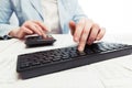 Financial accounting. Business woman using computer keyboard and calculator Royalty Free Stock Photo