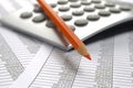 Financial accounting with red pencil and calculator Royalty Free Stock Photo