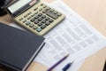 Financial accounting report with book and calculator Royalty Free Stock Photo