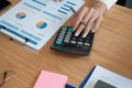 Financial adviser use calculator to calculate revenue & budget. accountant doing accounting. bookkeeper making calculation Royalty Free Stock Photo