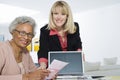 Financial Advisor Assisting Senior Woman Royalty Free Stock Photo