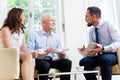 Financial advisor consulting couple in retirement planning Royalty Free Stock Photo