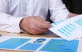 Financial Advisor or Trader analyzing financial performance data to find stock in stock markets, uptrends