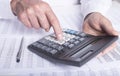 Financial analysis concept, male hands using a calculator over accounting documents, extra closeup Royalty Free Stock Photo