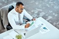 Financial analyst, focus and black businessman planning in an office or reading report and employee on desk. Serious Royalty Free Stock Photo