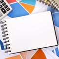 Financial background with blank notebook Royalty Free Stock Photo