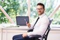 Financial businessman having a phone call while sitting at office desk and working Royalty Free Stock Photo