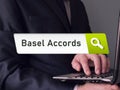 Financial concept about Basel Accords with phrase on the piece of paper