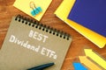 Financial concept about Best Dividend ETFs with phrase on the piece of paper Royalty Free Stock Photo