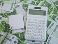 Financial concept closeup of pen and calculator with money euro bills and space for text Royalty Free Stock Photo