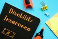 Financial concept about Disability Insurance with phrase on the piece of paper