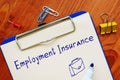Financial concept about Employment Insurance EI with sign on the sheet