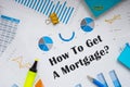 Financial concept about How To Get A Mortgage? with inscription on the piece of paper Royalty Free Stock Photo