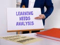 Financial concept about LEARNING NEEDS ANALYSIS with phrase on the piece of paper