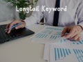 Financial concept about Longtail Keyword with sign on the page Royalty Free Stock Photo