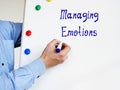 Financial concept about Managing Emotions with inscription on the page