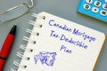 Financial concept meaning Canadian Mortgage Tax-Deductible Plan with sign on the piece of paper