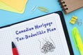 Financial concept meaning Canadian Mortgage Tax-Deductible Plan with sign on the sheet