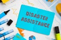 Financial concept meaning Disaster Assistance with phrase on the sheet Royalty Free Stock Photo