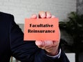 Financial concept meaning Facultative Reinsurance with sign on the sheet