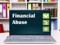 Financial concept meaning Financial Abuse with sign on the computer
