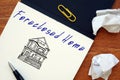 Financial concept meaning Foreclosed Home with phrase on the page Royalty Free Stock Photo