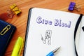 Financial concept meaning Give Blood with sign on the page