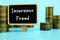 Financial concept meaning Insurance Fraud with sign on the piece of paper