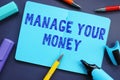 Financial concept meaning Manage Your Money with phrase on the piece of paper Royalty Free Stock Photo