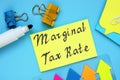 Financial concept meaning Marginal Tax Rate with phrase on the piece of paper