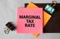 Financial concept meaning Marginal Tax Rate with phrase on the piece of paper.