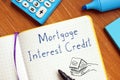 Financial concept meaning Mortgage Interest Credit with inscription on the piece of paper Royalty Free Stock Photo