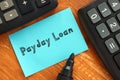 Financial concept meaning Payday Loan with phrase on the sheet