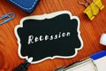 Financial concept meaning Recession with inscription on the piece of paper Royalty Free Stock Photo