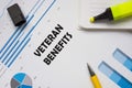 Financial concept meaning VETERAN BENEFITS with phrase on the piece of paper