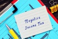 Financial concept about Negative Income Tax with sign on the piece of paper