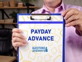 Financial concept about PAYDAY ADVANCE with sign on the page