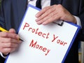 Financial concept about Protect Your Money with sign on the piece of paper Royalty Free Stock Photo