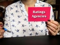 Financial concept about Ratings Agencies with inscription on blank business card