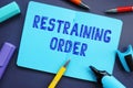 Financial concept about Restraining Order with phrase on the sheet