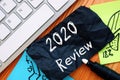Financial concept about 2020 Review with inscription on the sheet