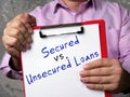 Financial concept about Secured vs. Unsecured Loans with inscription on the page