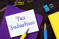 Financial concept about Tax Deductions with phrase on the sheet