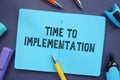 Financial concept about Time To Implementation with sign on the piece of paper Royalty Free Stock Photo