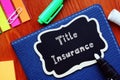 Financial concept about Title Insurance with phrase on the piece of paper Royalty Free Stock Photo
