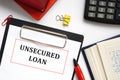 Financial concept about UNSECURED LOAN with phrase on the piece of paper Royalty Free Stock Photo