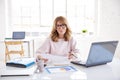 Financial consultan businesswoman working on laptop in the office