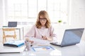 Financial consultan businesswoman working on laptop in the office