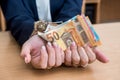 female hands with handcuffs and euro bills Royalty Free Stock Photo