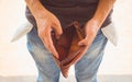 Financial difficulties, bad economy, o money concept. Young man showing empty pockets, part of body male hips wearing jeans pants Royalty Free Stock Photo